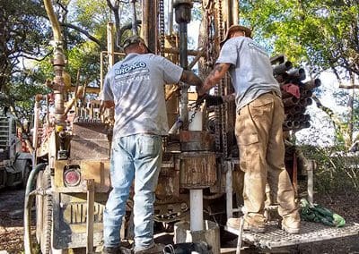 2 Bronco Boys busy working on a drilling rig